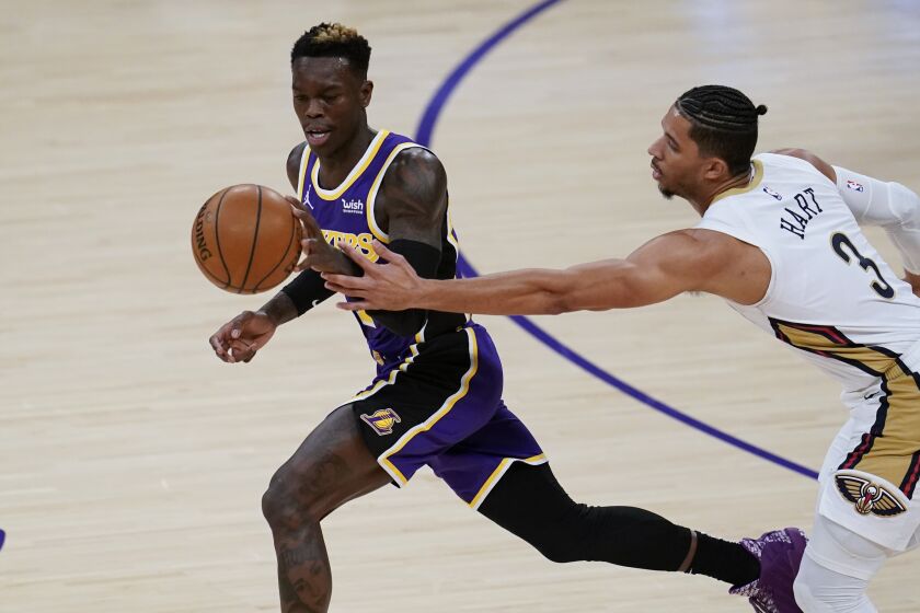 New Orleans Pelicans guard Josh Hart (3) tries to take the ball from Los Angeles Lakers guard Dennis Schroder.