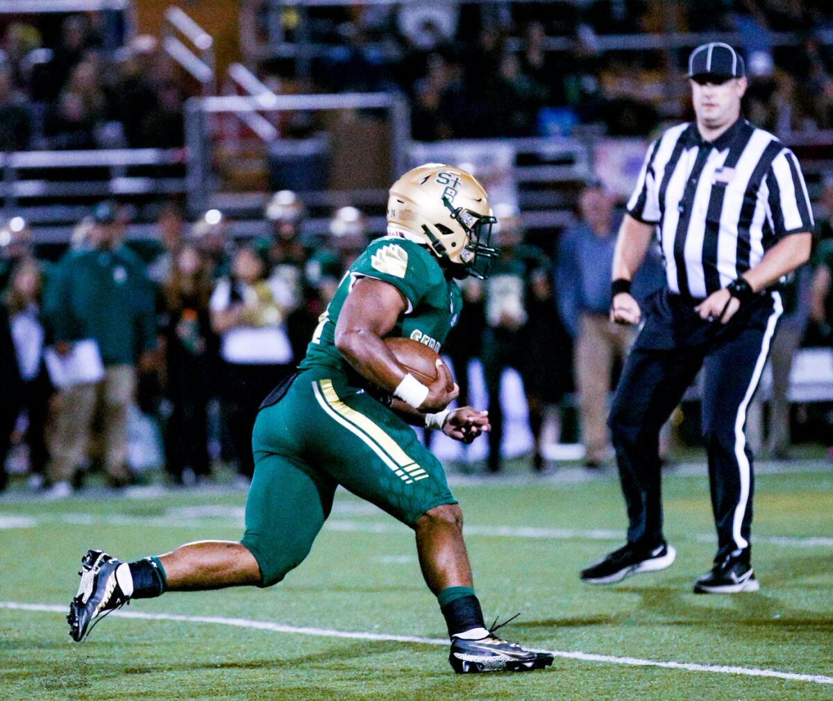 St. Bonaventure's Delon Thompson picks up some yards on Thursday.