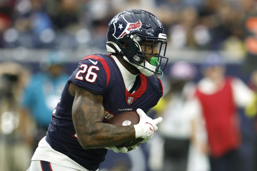 Houston Texans running back Royce Freeman (26) carries the ball during an NFL football game.