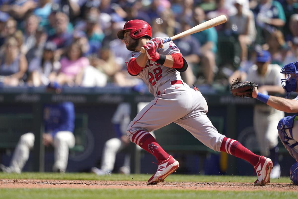 Los Angeles Angels' David Fletcher hits an RBI single in the seventh inning.