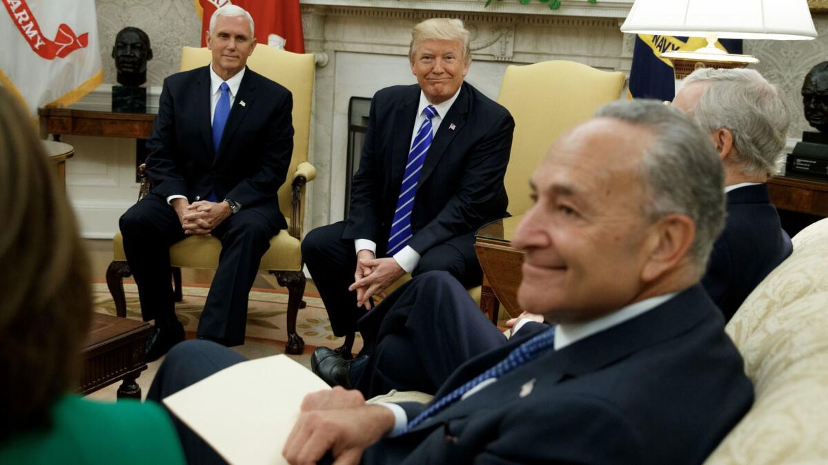 Vice President Mike Pence looks on with President Trump during a meeting with Senate Minority Leader CharlesSchumer and other congressional leaders in the White House on Sept. 6.