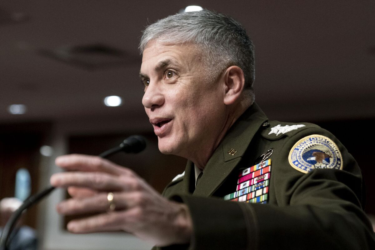 FILE - U.S. Cyber Command head, National Security Agency Director and Central Security Service Chief Gen. Paul Nakasone attends a Senate Armed Services hearing on Capitol Hill in Washington, Tuesday, April 5, 2022. The Pentagon’s cyber arm says a team spent months working with officials in Lithuania to help protect government networks there from cyberattacks. (AP Photo/Andrew Harnik, File)