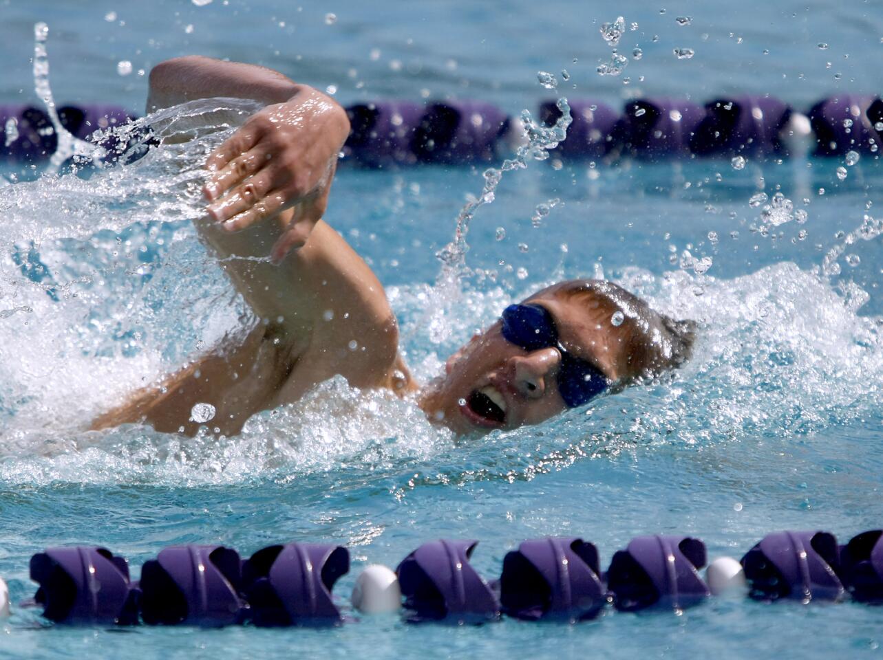 Clark Magnet High senior and Hoover High swimmer Jason Barbar swims to a first place finish in the Varsity 200 freestyle event during meet at Hoover High School in Glendale on Tuesday, April 23, 2013.