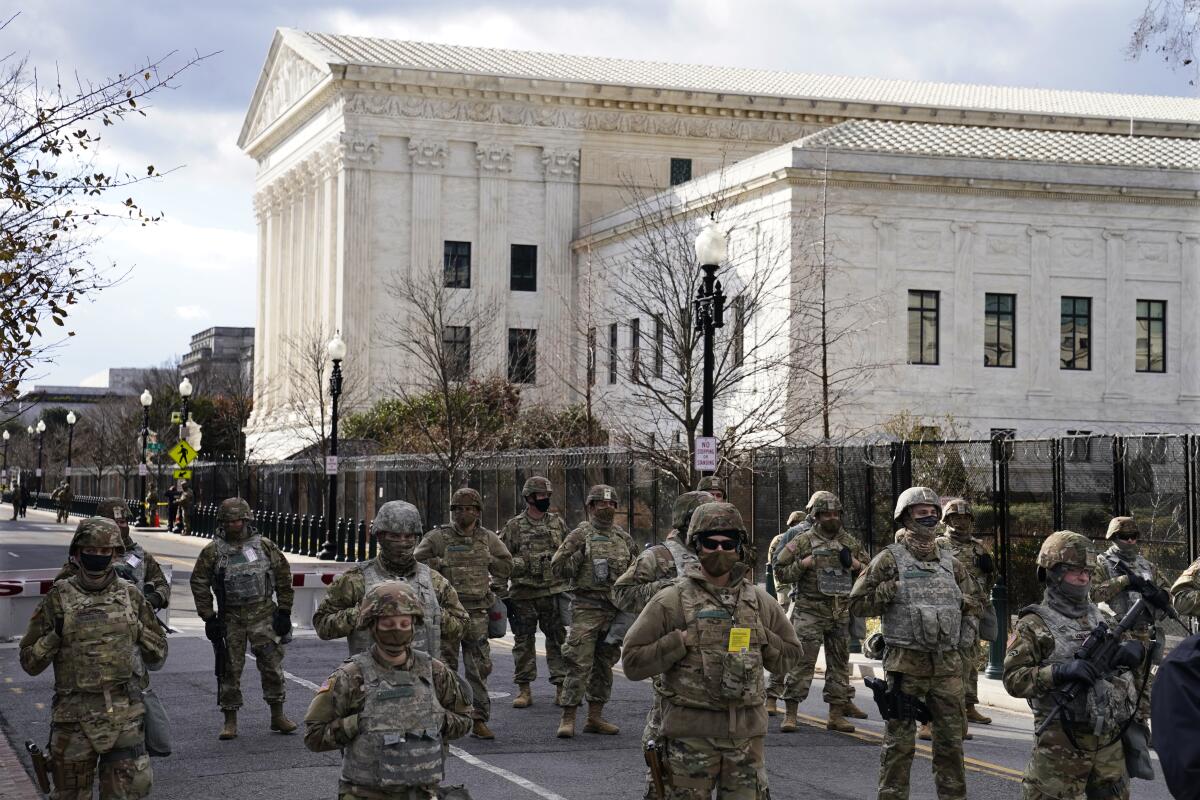 National Guard members stand near the Supreme Court ahead of President Biden's inauguration