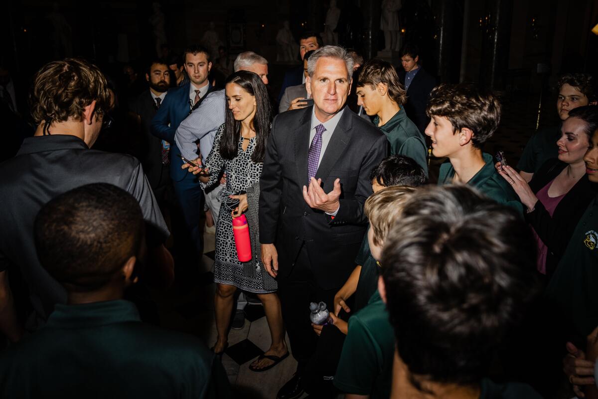 Kevin McCarthy stands in small crowd of people 