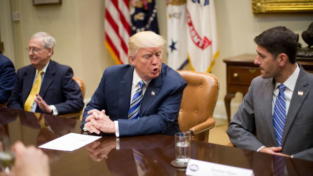In a file photo, President Trump talks to House Speaker Paul D. Ryan during a meeting at the White House.