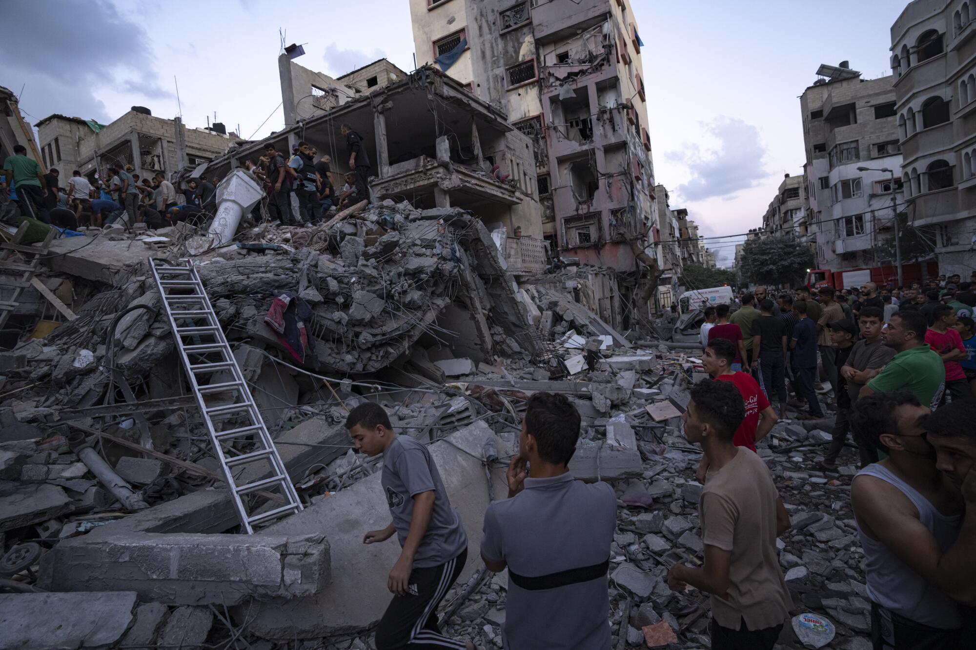 People search for survivors in the rubble of Gaza homes.