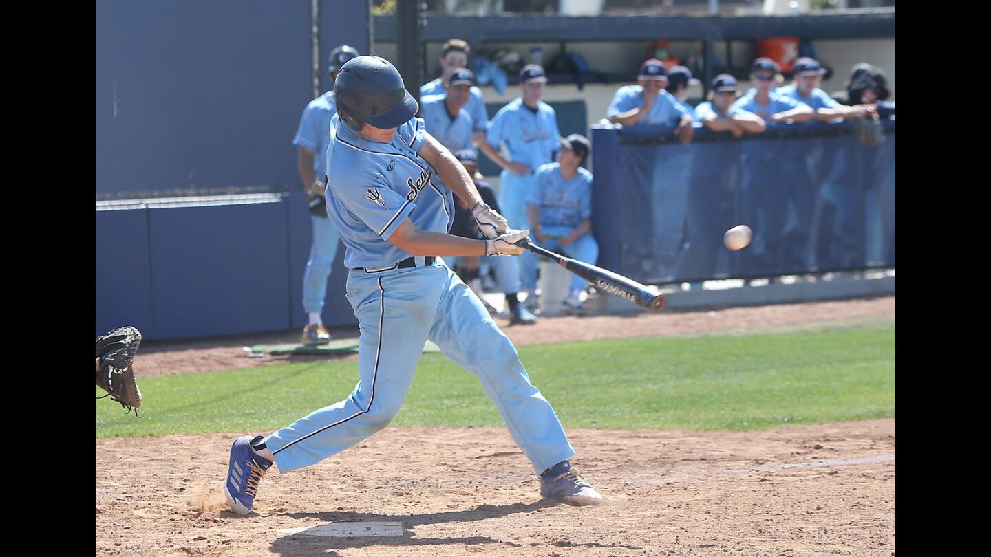 Corona del Mar High's Nick Rottler rips a two-run homer during the Newport Rib Co. Tournament game against Laguna Hills on Tuesday.