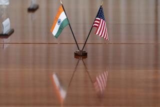 FILE- The countries' flags are seen on the table during a meeting with India's Foreign Minister Subrahmanyam Jaishankar and U.S. Secretary of Defense Lloyd Austin at the Pentagon, Monday, Sept. 26, 2022, in Washington. India has set up a high-level inquiry after U.S. authorities raised concerns with New Delhi that its government may have had knowledge of a plot to kill a Sikh separatist leader Gurpatwant Singh Pannun on American soil, an Indian official said on Wednesday, Nov. 29, 2023. (AP Photo/Alex Brandon)