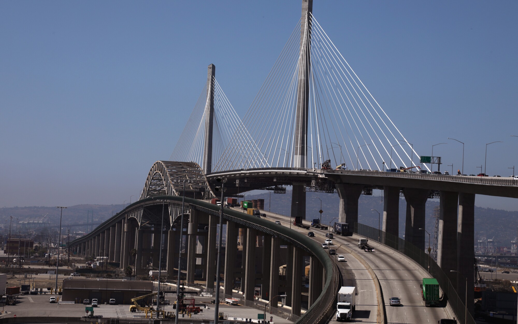 Construction workers work on the Gerald Desmond Bridge