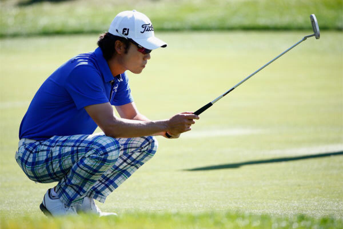 Kevin Na assesses a putt Saturday during the third round of the Valspar Championship in Palm Harbor, Fla.