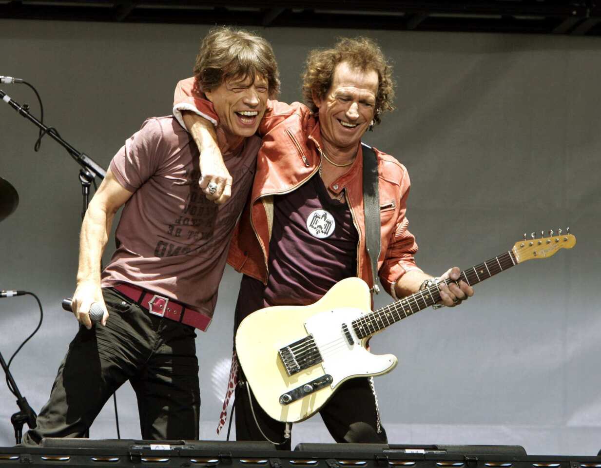 Mick Jagger and Keith Richards embrace in New York while announcing the band's 2005 tour.