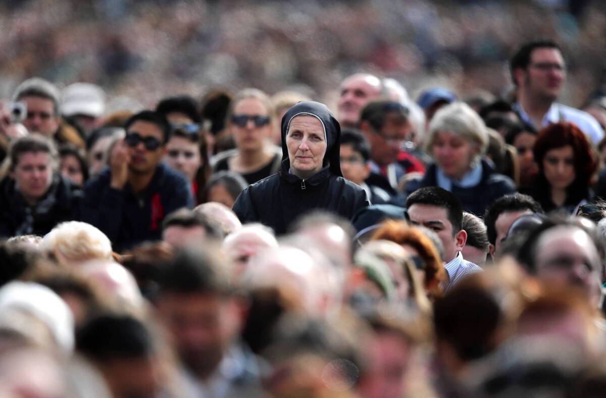 A nun watches Pope Francis hold Mass in Vatican City last month before his first Easter message. The Vatican said Francis had "reaffirmed the findings of the assessment and the program of reform" prescribed for the Leadership Conference of Women Religious.