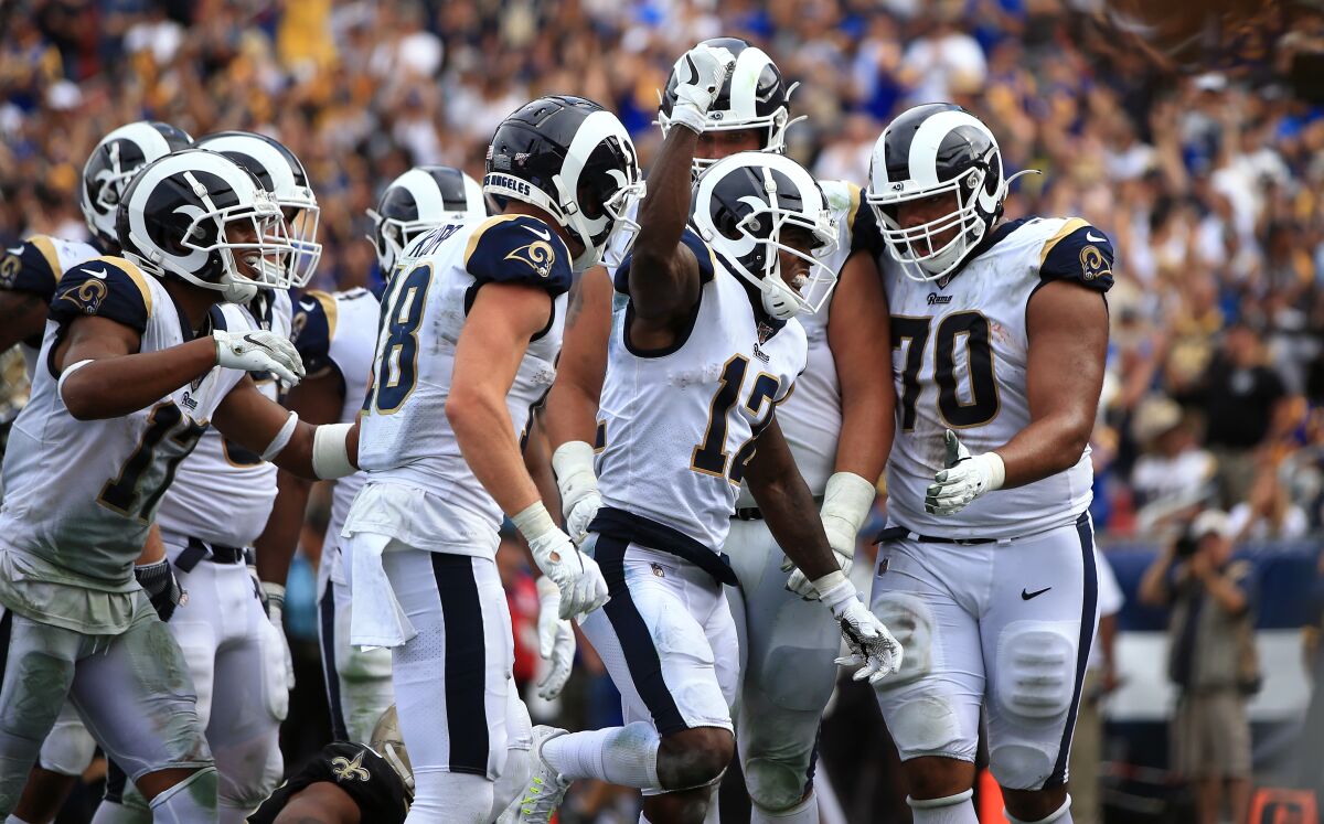Rams wide receiver Brandin Cooks celebrates with teammates after scoring a touchdown.