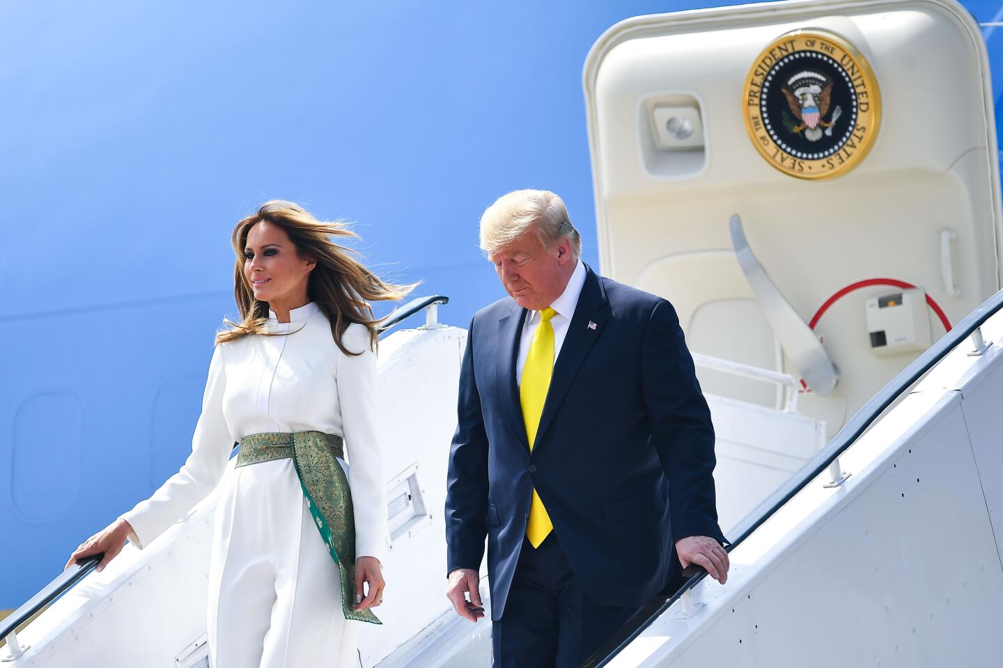 US President Donald Trump and First Lady Melania Trump disembark from Air Force One at Sardar Vallabhbhai Patel International Airport in Ahmedabad on February 24, 2020. (Photo by MANDEL NGAN / AFP) (Photo by MANDEL NGAN/AFP via Getty Images)