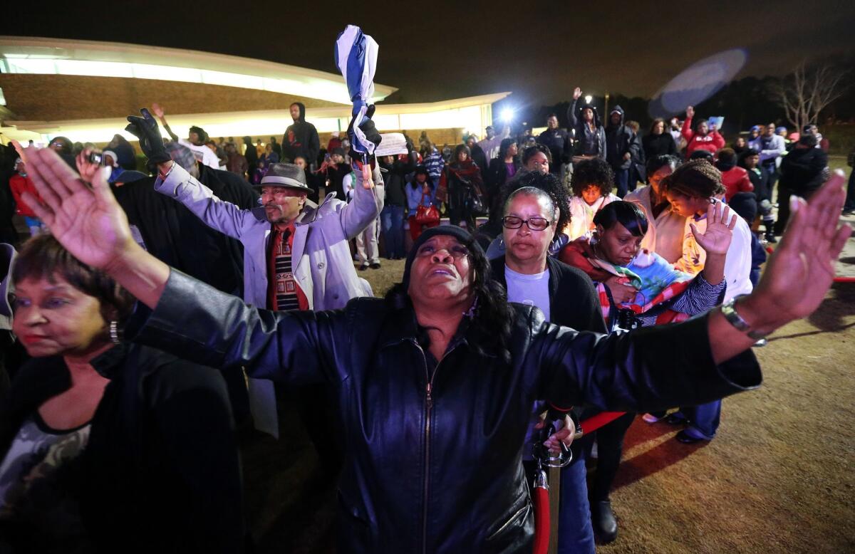 Denice Matthews of Riverdale, Ga., was among those at a prayer vigil held Monday night for Bobbi Kristina Brown outside Atlanta.