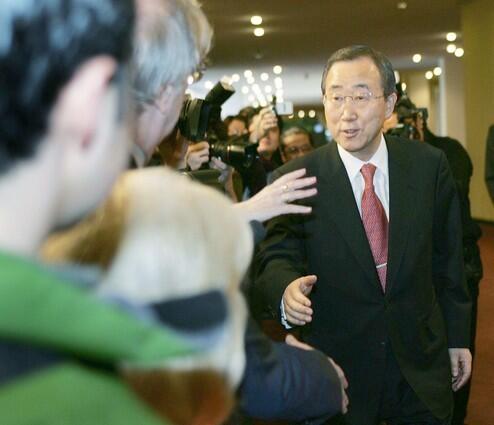 United Nations Secretary General Ban Ki-moon greets reporters upon his arrival for his first day in office.