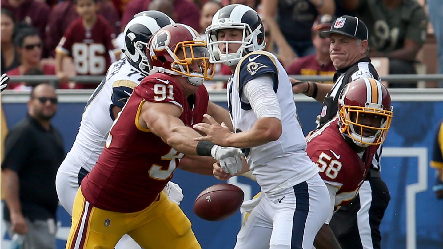 Redskins linebacker Ryan Kerrigan knocks the ball out of the hands of Rams quarterback Jared Goff in the second quarter on Sept. 17.