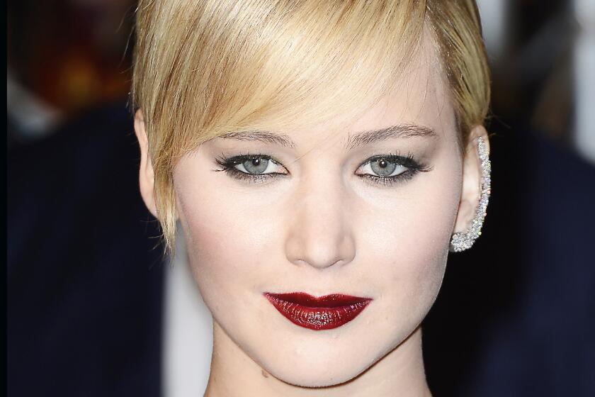 Jennifer Lawrence with a diamond ear cuff at the Paris premiere of "The Hunger Games: Catching Fire" in 2013.