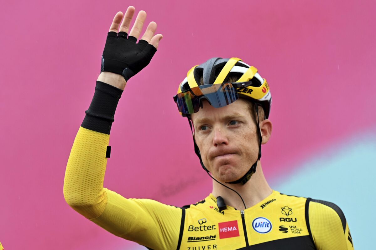 Steven Kruijswijk waves prior to the eight stage of the Giro d'Italian cycling race from San Salvo to Roccaraso, Sunday Oct. 11, 2020. All riders and team staff members were tested for COVID-19 over the last 48 hours coinciding with Monday’s rest day with a total of 571 tests performed. Team Jumbo-Visma announced that Steven Kruijswijk came back positive and was withdrawn. (Gian Mattia D'Alberto/LaPresse via AP)