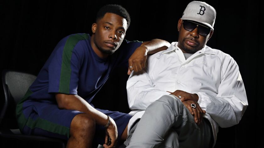 Woody McClain, left, star of BET's "The Bobby Brown Story," and the pop star himself in early August in Los Angeles.
