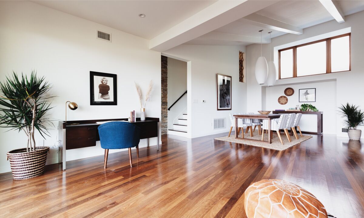 Wood floors, clean lines and white walls in Kristen Schaal's home.