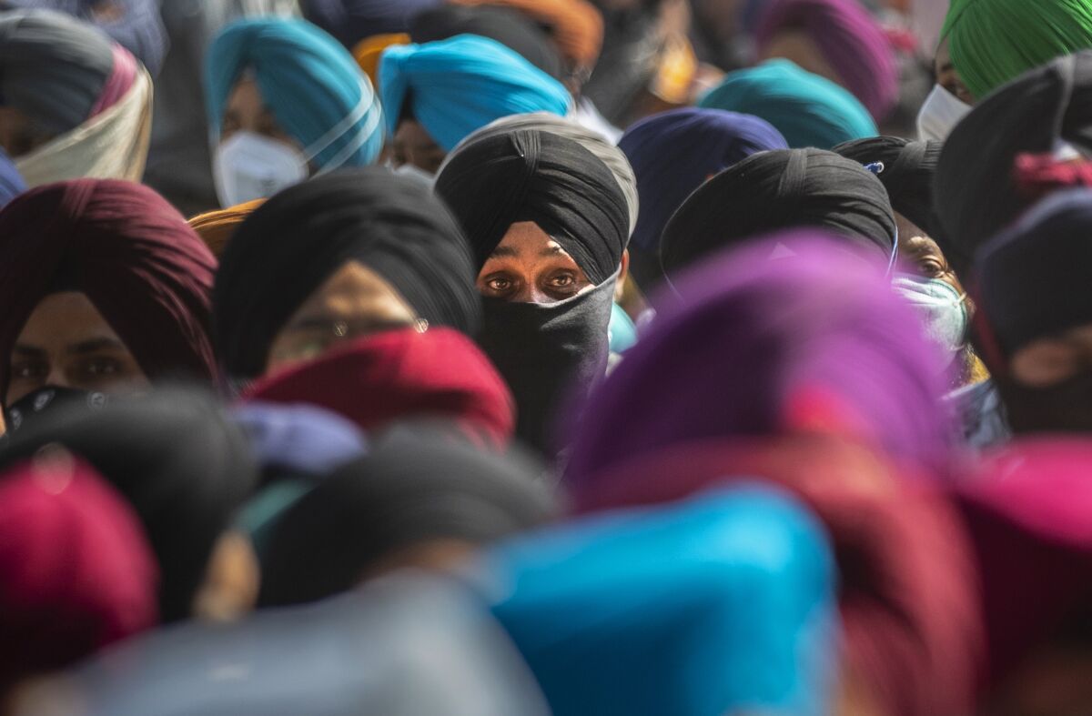 Sikh community members participate in the funeral procession of slain Satinder Kaur, a government school teacher in Srinagar, India, Friday, Oct. 8, 2021. Assailants fatally shot two schoolteachers in Indian-controlled Kashmir on Thursday in a sudden rise in targeted killings of civilians in the disputed region, police said. (AP Photo/Mukhtar Khan)