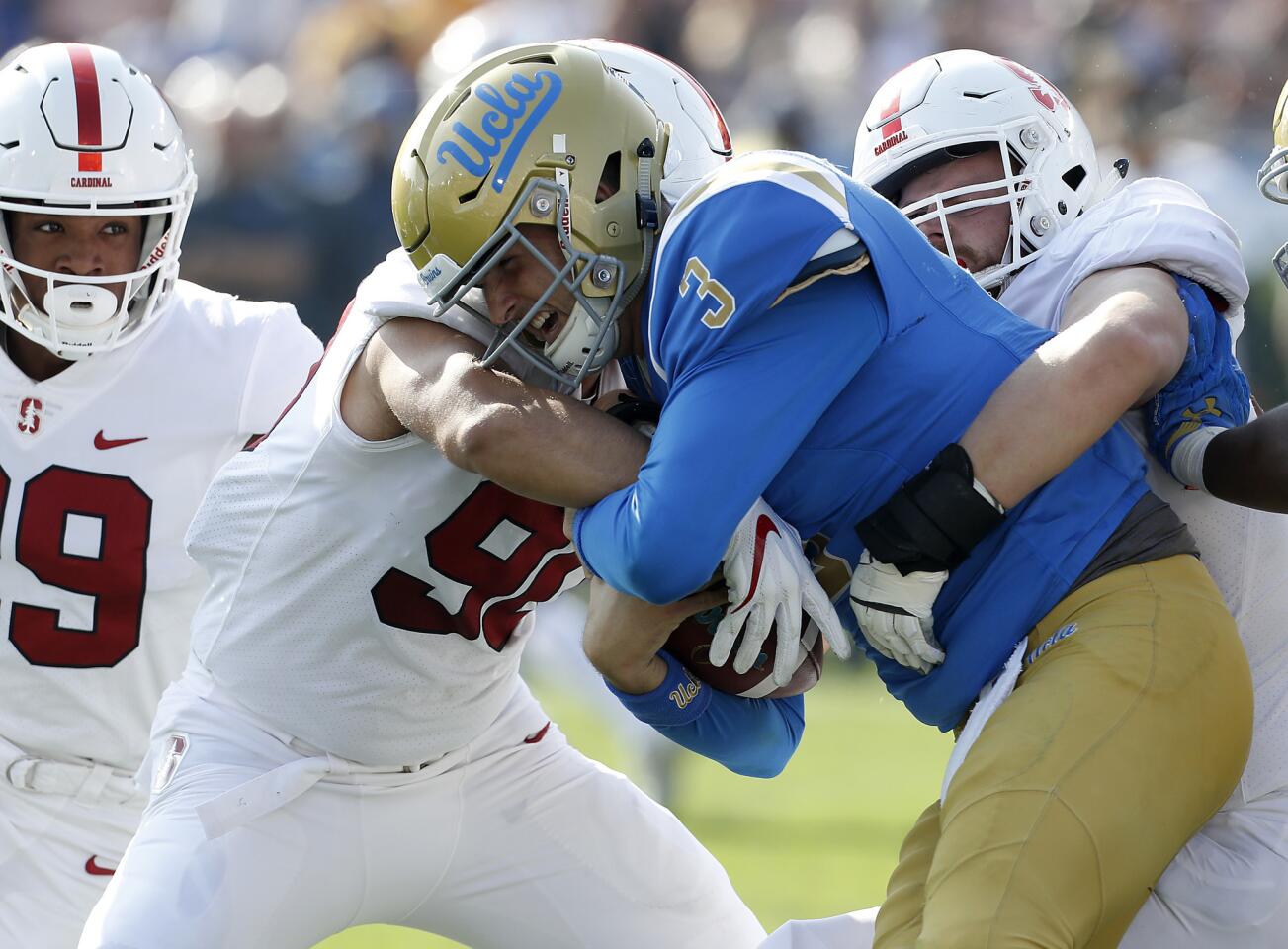UCLA quarterback Wilton Speight fights for extra yardage against Stanford in the second quarter.