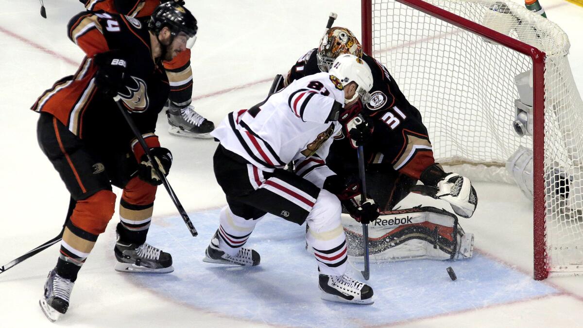 Blackhawks right wing Marian Hossa (81) knocks in a goal off his skate on a rebound against Ducks defenseman Simon Despres and goalie Frederik Andersen in the second period of Game 7.