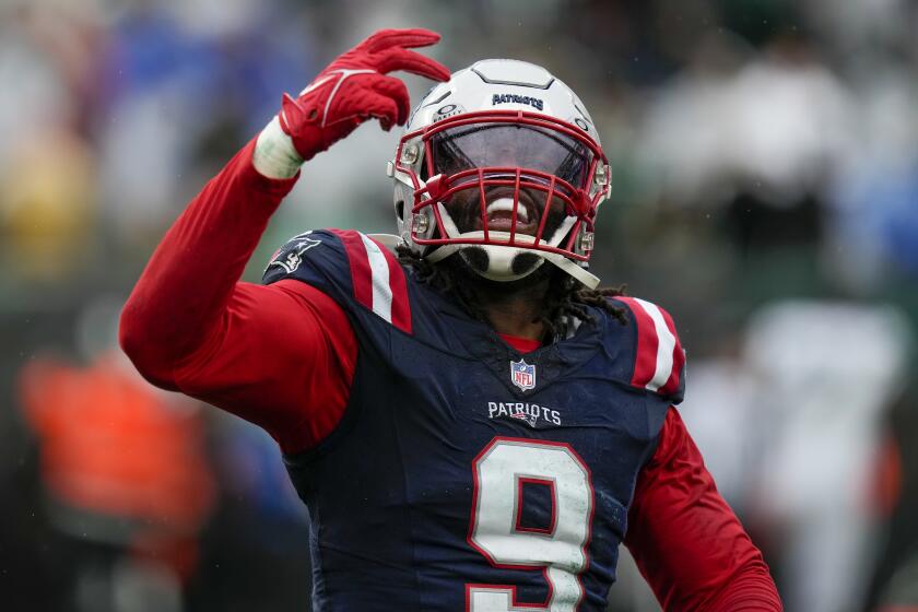 New England Patriots linebacker Matthew Judon (9) reacts after sacking New York Jets quarterback Zach Wilson (2) in the end zone for a safety during the fourth quarter of an NFL football game, Sunday, Sept. 24, 2023, in East Rutherford, N.J. (AP Photo/Seth Wenig)