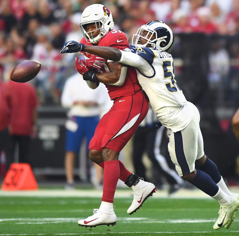 Rams linebacker Cory Littleton knocks the ball away on a pass intended for Arizona Cardinals running back David Johnson in the first qaurter at State Farm Stadium on Sunday.