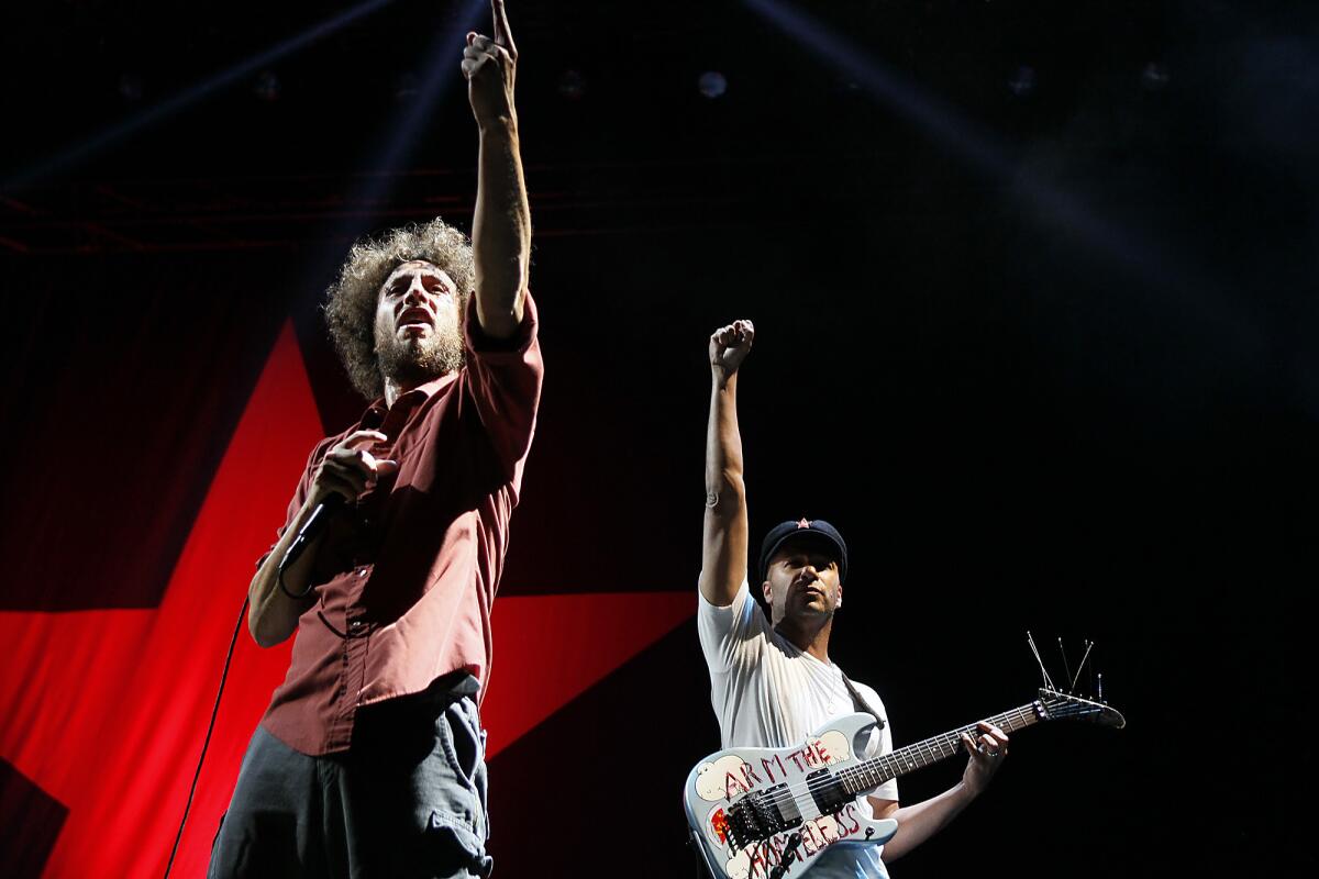 Zack de la Rocha and Tom Morello, right, of Rage Against the Machine headline the LA Rising concert on July 30, 2011.