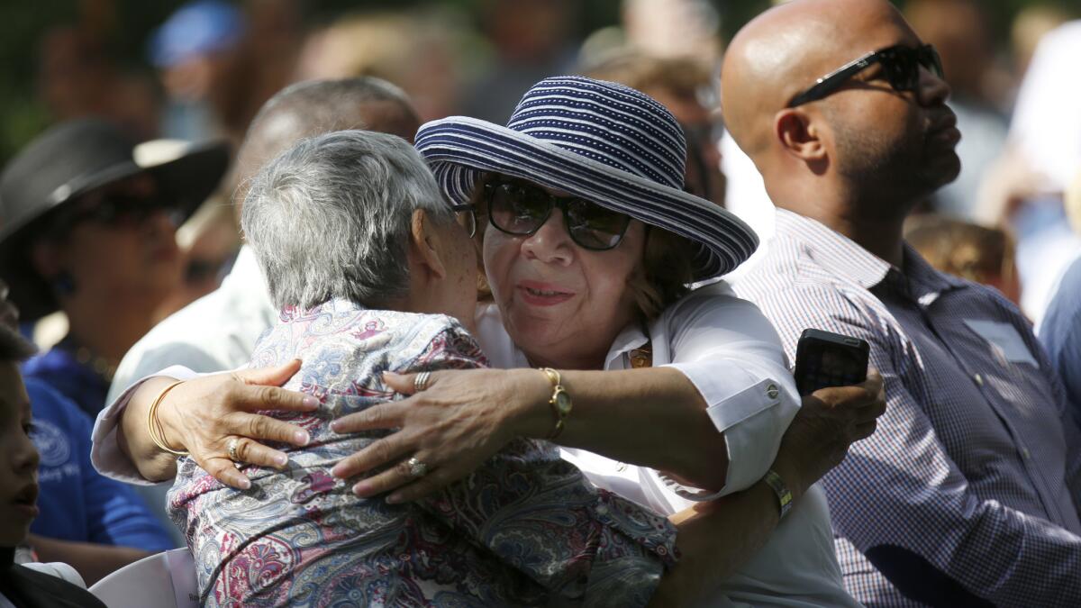 Gold Star family members Irene Ramirez of Pasadena, left, and Deborah Whitley of Altadena hug during the ceremony.