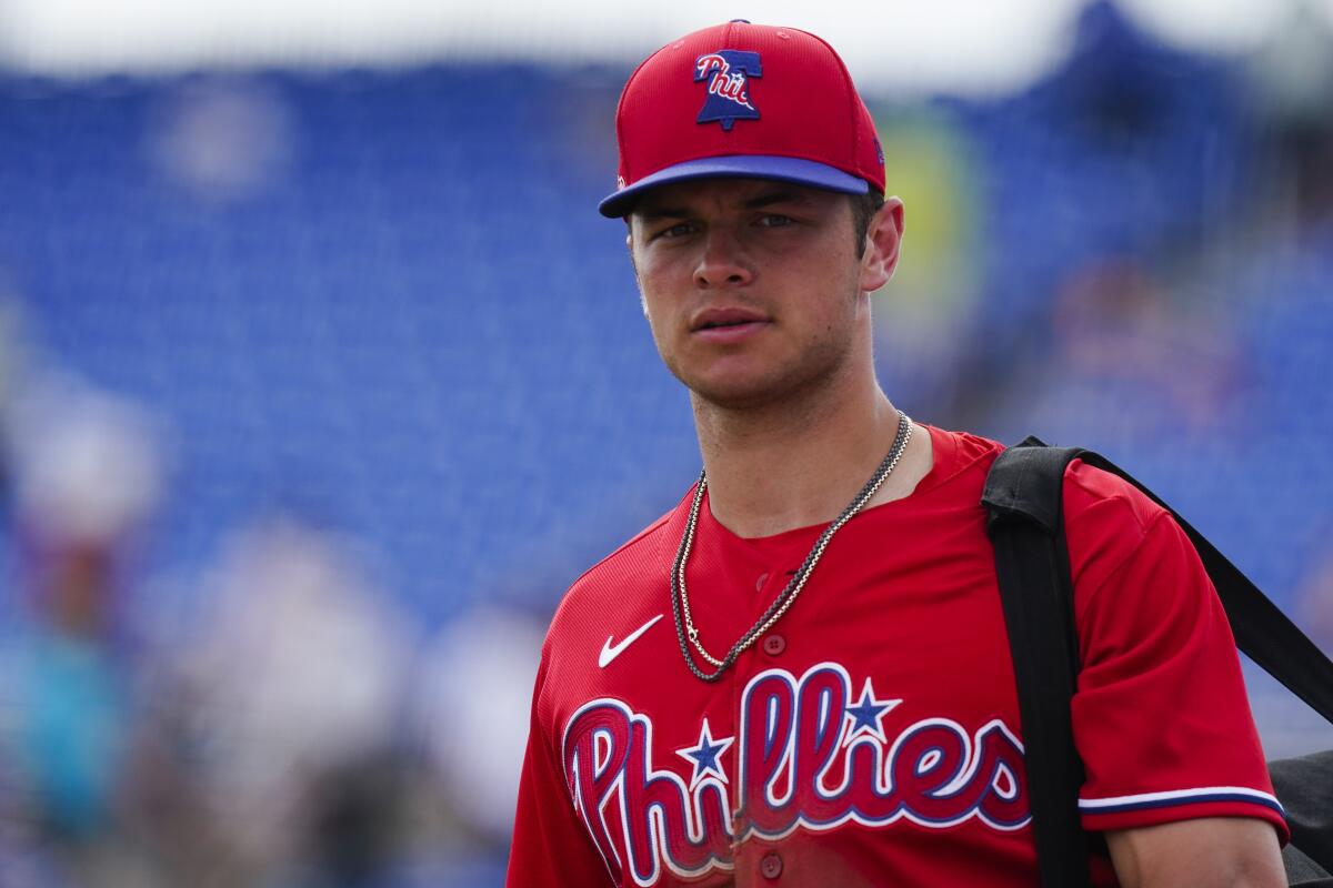 Logan O'Hoppe walks on the field after a spring training game.