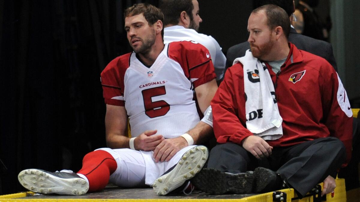 Arizona Cardinals quarterback Drew Stanton is carted off the field after suffering a partially torn anterior cruciate ligament and a sprained medial collateral ligament in the same knee Thursday against the St. Louis Rams.