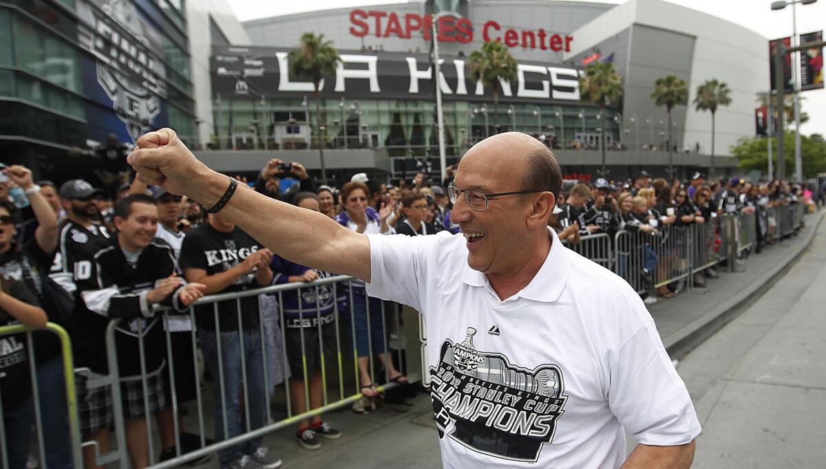 Kings broadcaster Bob Miller is cheered by fans as they turn out in 2012 to celebrate the team's first Stanley Cup championship.