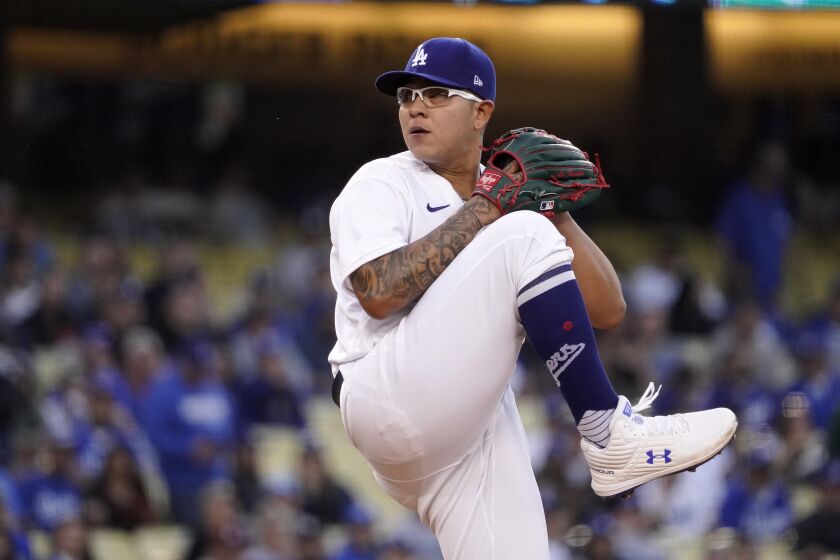 Dodgers starting pitcher Julio Urías throws to the plate against the Giants Tuesday