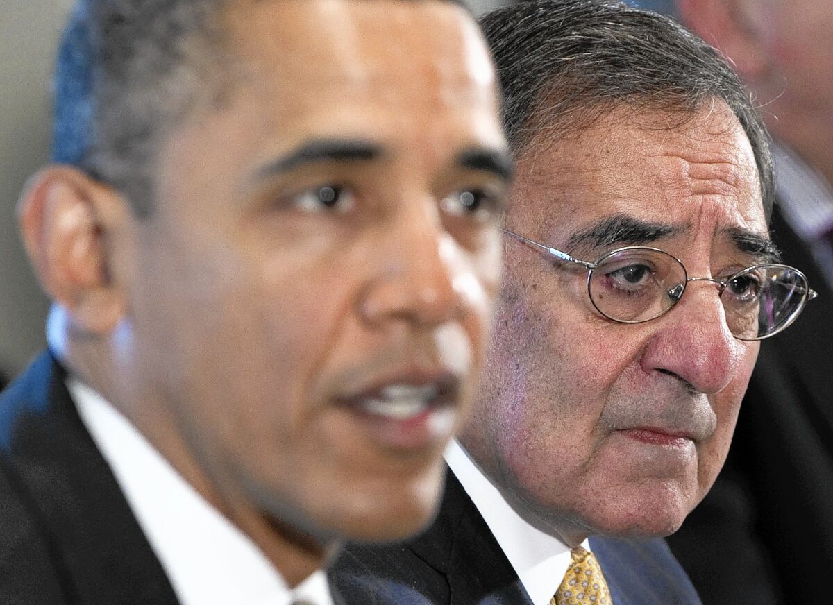 President Obama and then-Defense Secretary Leon E. Panetta in 2012. Panetta says in his new book that Obama "avoids the battle, complains and misses opportunities."