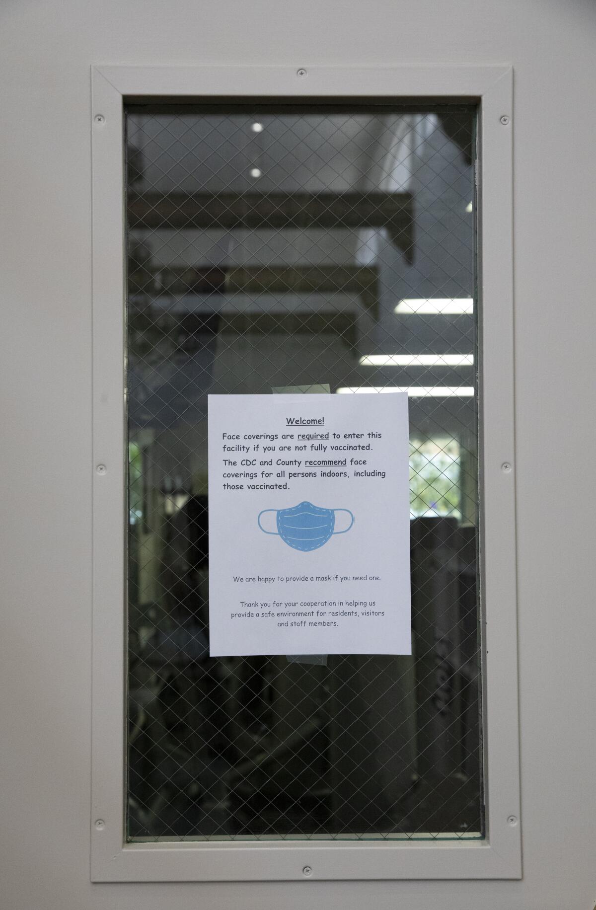 A sign is posted outside of a gym at the Ocean Hills Country Club's clubhouse 