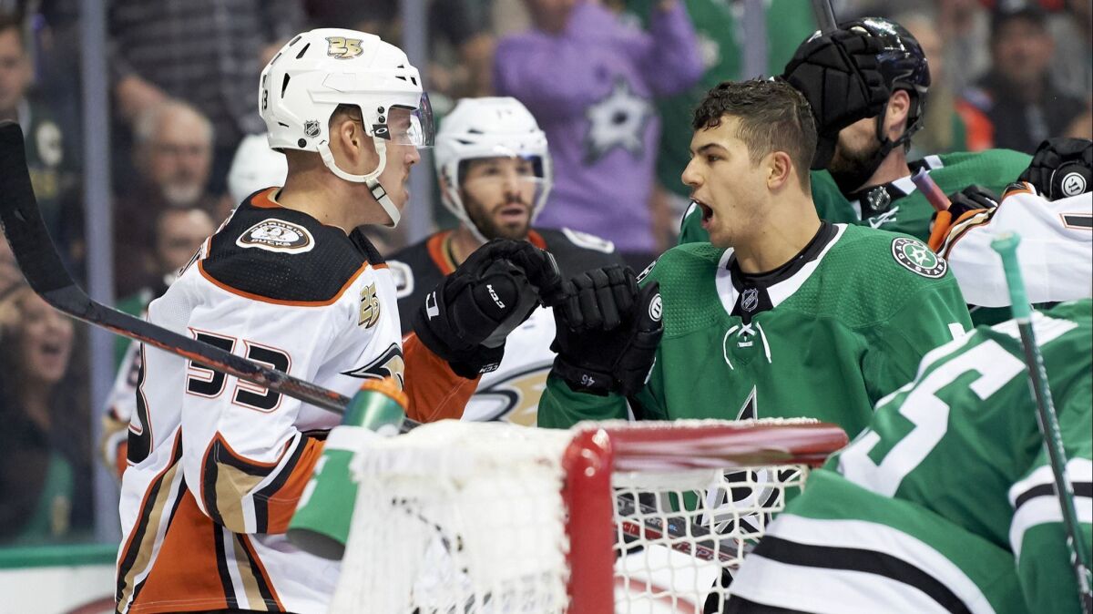 Dallas Stars defenseman Connor Carrick (5) has words with Ducks left wing Max Comtois (53) during the second period.