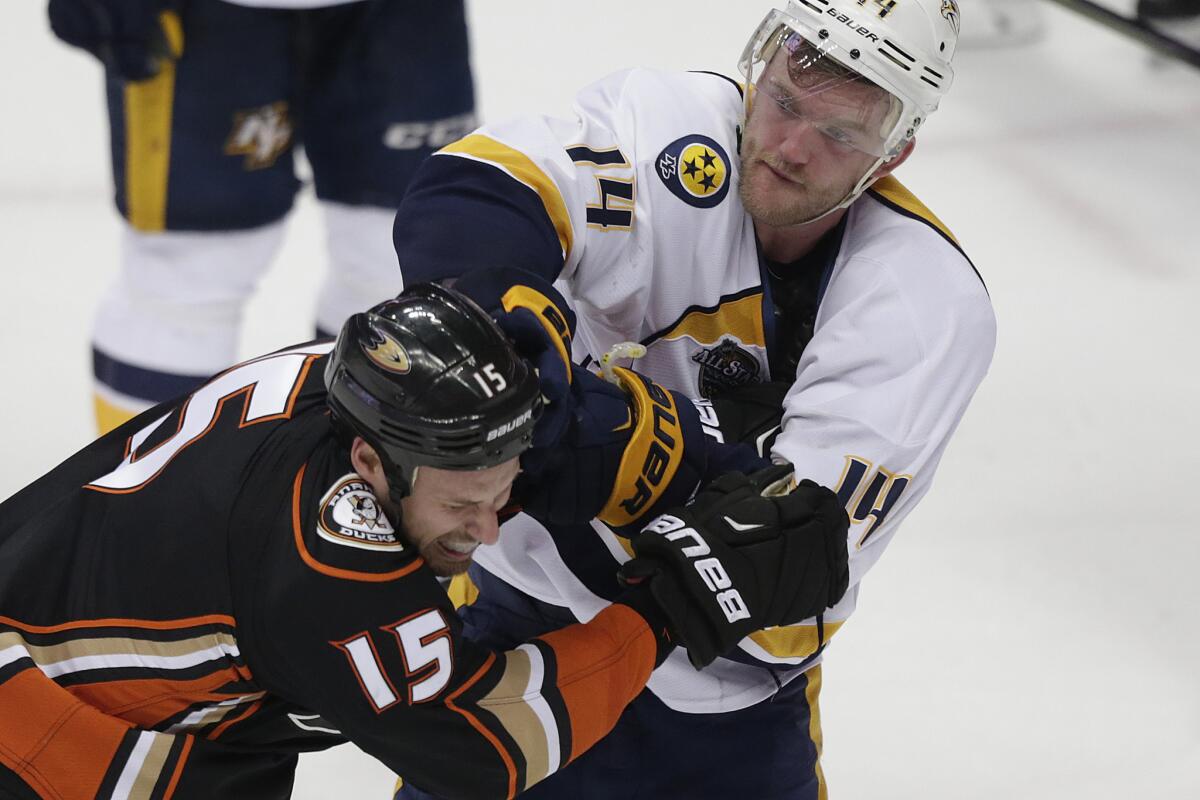Ducks captain Ryan Getzlaf mixes it up with Predators defenseman Mattias Ekholm seconds after a 3-2 loss to Nashville in Game 1 of their playoff series.