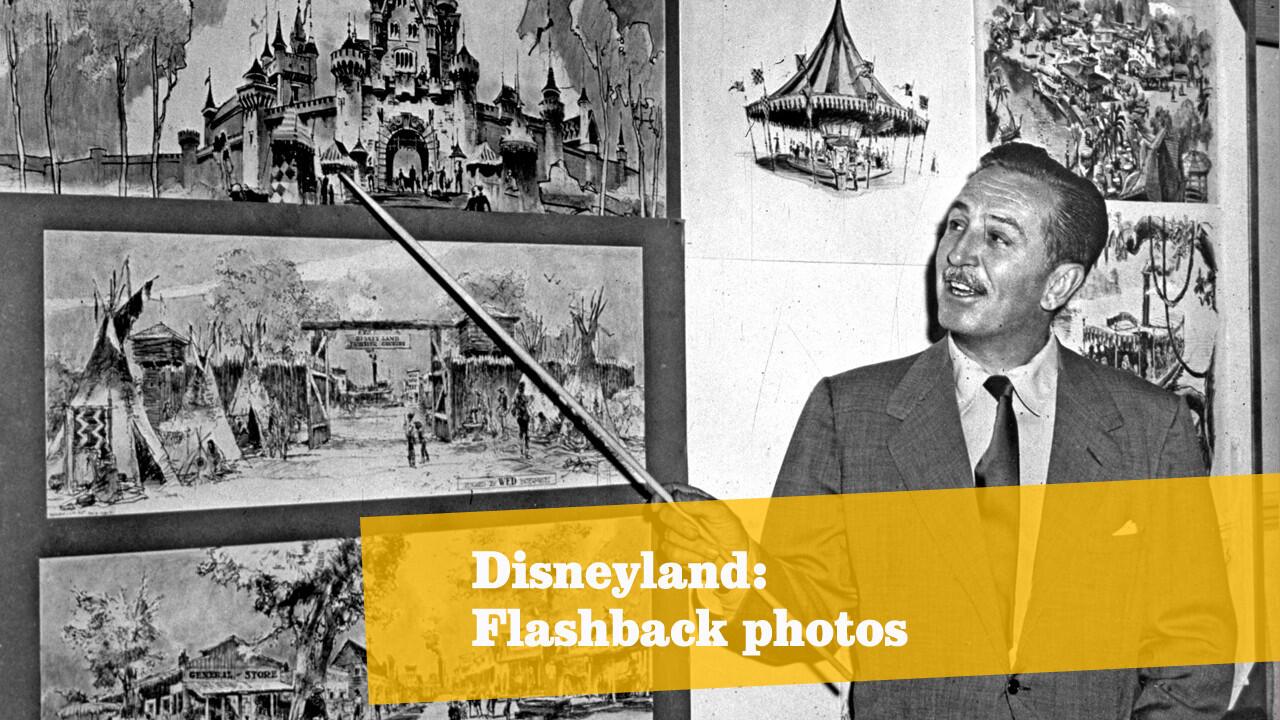 American producer, director and animator Walt Disney goes over sketches of Disneyland in 1955.