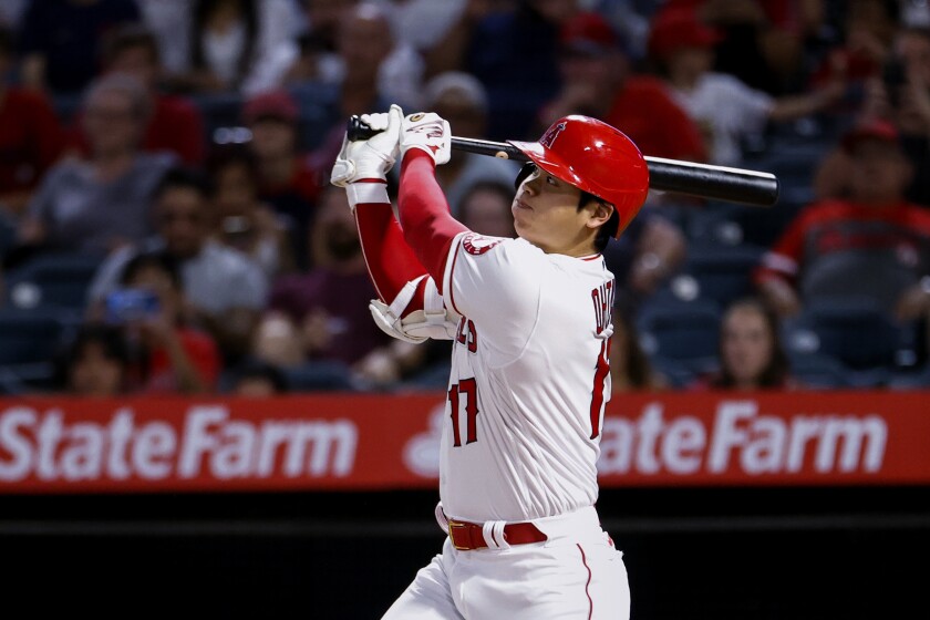 Los Angeles Angels' Shohei Ohtani watches his three-run home run during the sixth inning of the team's baseball game against the Texas Rangers in Anaheim, Calif., Saturday, Sept. 4, 2021. (AP Photo/Ringo H.W. Chiu)