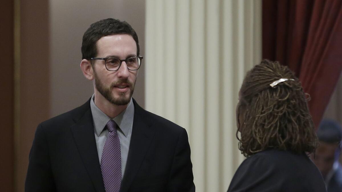 State Sen. Scott Wiener (D-San Francisco), shown talking with Sen. Holly Mitchell (D-Los Angeles) in Sacramento in January, says his network neutrality bill was "eviscerated" by an Assembly committee on Wednesday.
