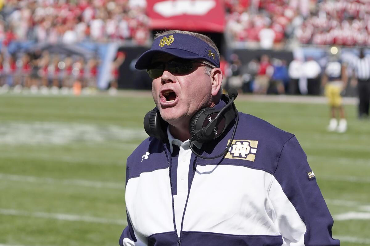 Notre Dame coach Brian Kelly yells at an official during a game against Wisconsin 