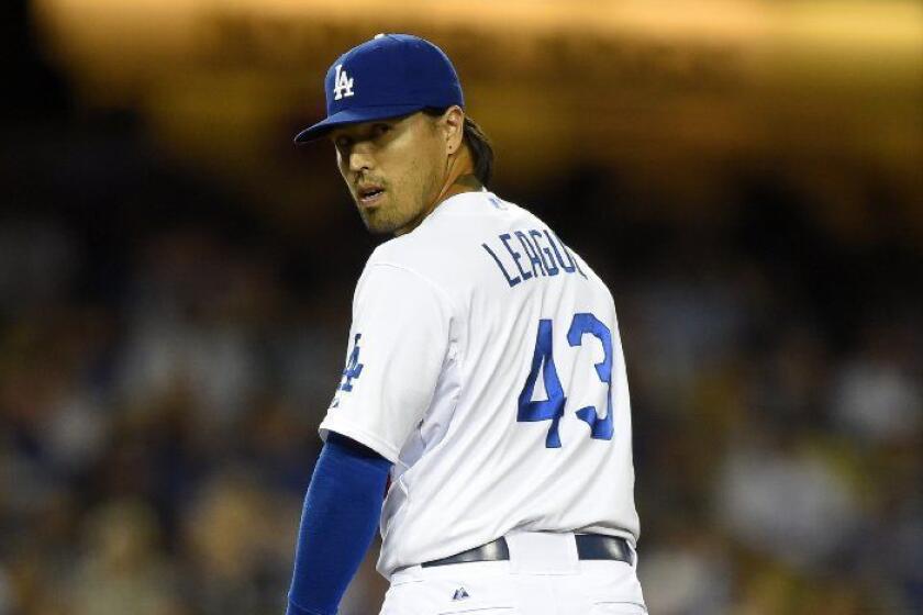 Los Angeles Dodgers relief pitcher Brandon League looks toward first during the fifth inning of a baseball game against the Detroit Tigers, Wednesday, April 9, 2014, in Los Angeles. (AP Photo/Mark J. Terrill) ** Usable by LA and DC Only **