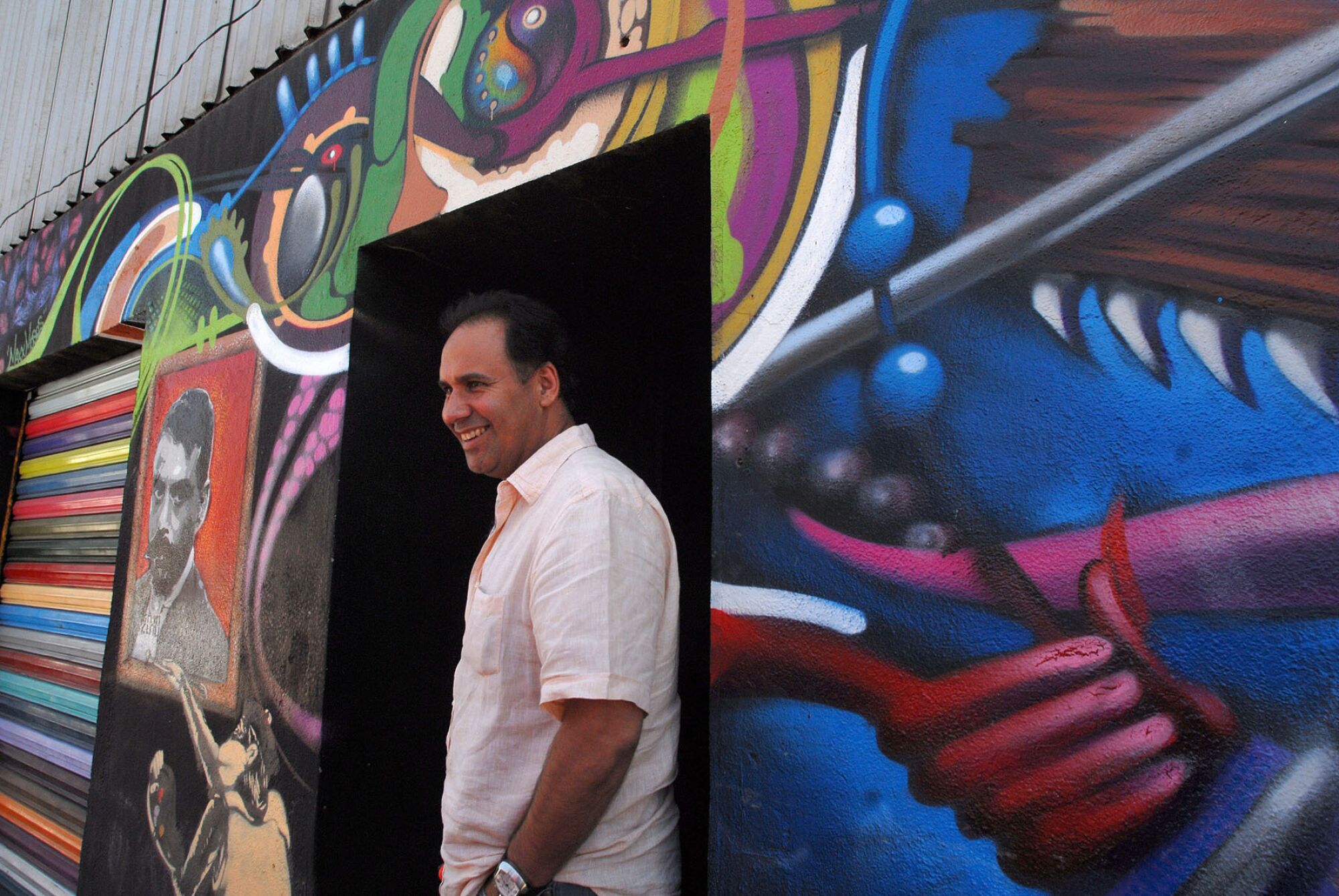 Arturo Rodriguez stands in front of the La Caja art gallery.
