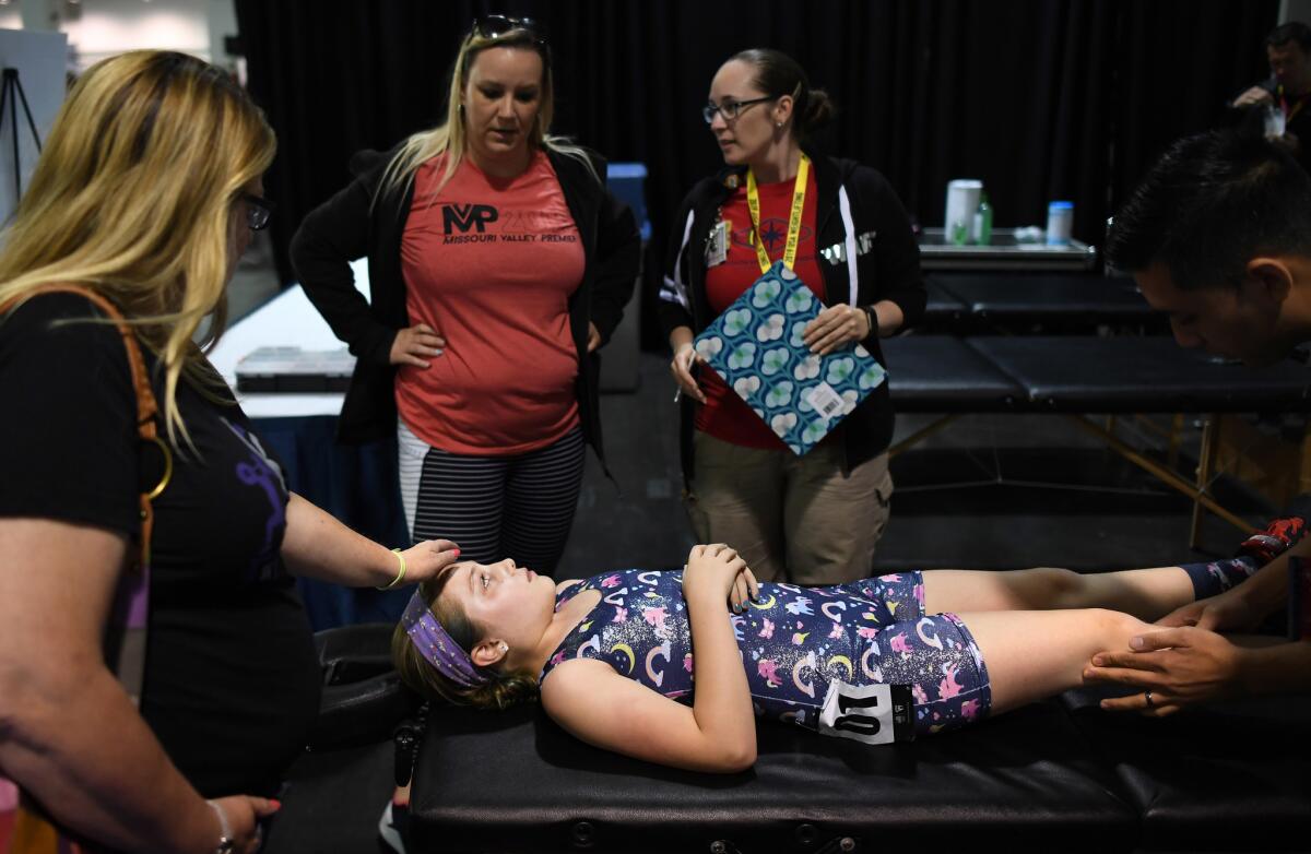 Samantha Goodman, 11, was injured during her competition in the under 11 category at the Anaheim Convention Center. (Wally Skalij / Los Angeles Times)