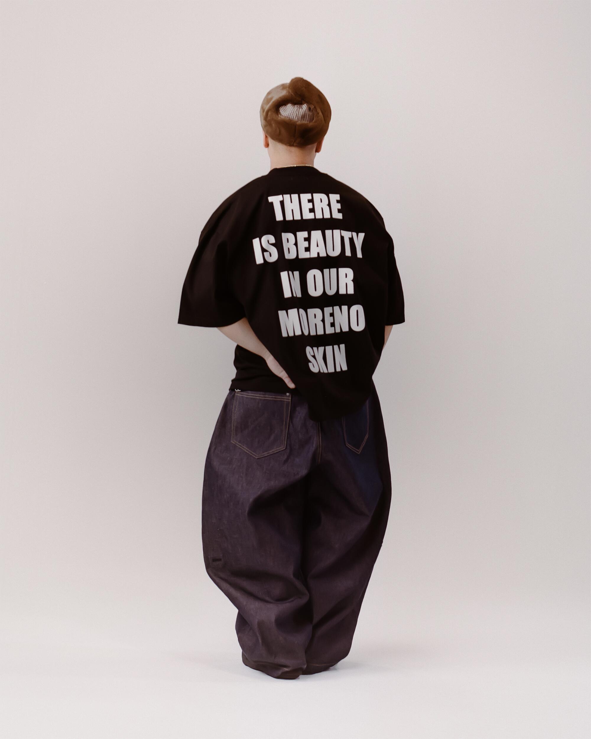 Miles wears FAMILY by Coen Clemente Moreno Oversized tee, Art Community Triptych Japanese Denim pants and Pilot Brim hat