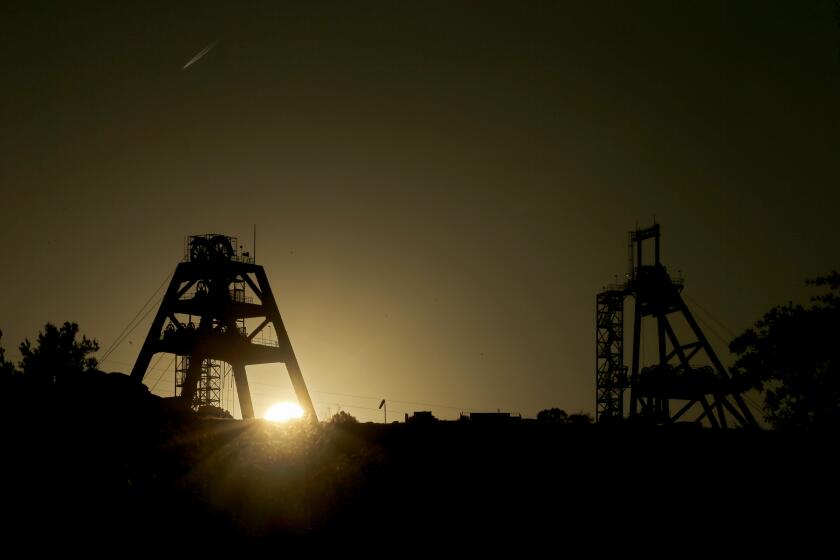 SUPERIOR, AZ - MAY 21, 2023. Mine shaft infrastructure is silhouetted against the setting sun at Oak Flat, a piece of desert wilderness in Arizona that is sacred to the Apache tribe. Oak Flat is under threat of complete destruction because of an expanded mining project proposed by Resolution Copper. The tribe has challenged mining companies in court, and their lawsuit is now before the 9th Circuit Court of Appeals, where it is pending as a case of religious liberty. (Luis Sinco / Los Angeles Times)